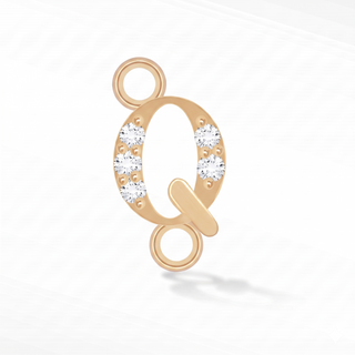 Nina Wynn sideways initial Q connector with lab-grown diamonds in solid 14k yellow gold.