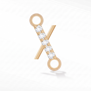 Nina Wynn sideways initial X connector with lab-grown diamonds in solid 14k yellow gold.