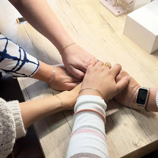 Silver mesh apple watch with black screen and white bezel for group event booking by jewelry designer nina wynn