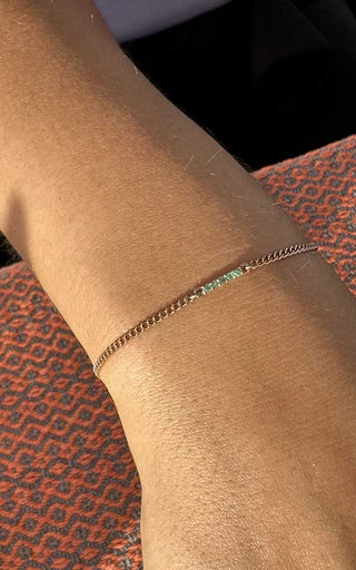 Close-up of clasp-less welded permanent jewelry on a client’s wrist in Denver.