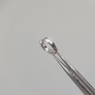 Flip seamlessly between a shiny diamond-accented front and a smooth polished back for effortless everyday layering