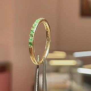 A detailed product video of the Thea 14K Gold Emerald Eternity Band. The video showcases the intricate handmade crafting process of the ring