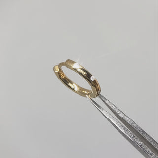 Gold diamond hoop earrings worn in lifestyle video