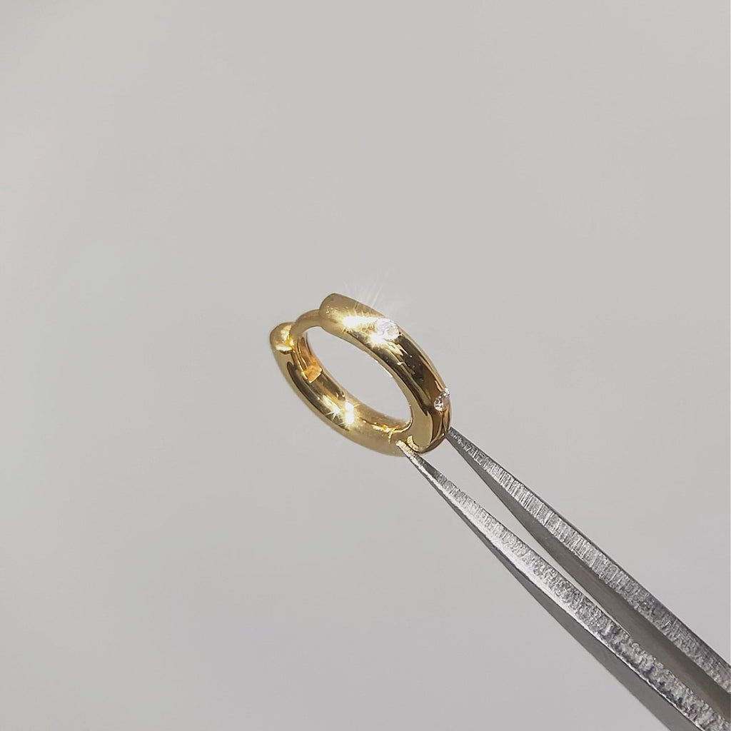 Vermeil hoop earrings with diamonds shown on moving