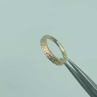  Cinematic clip showcasing the soft, ethereal shimmer of the hand-etched gold surface as it catches the light
