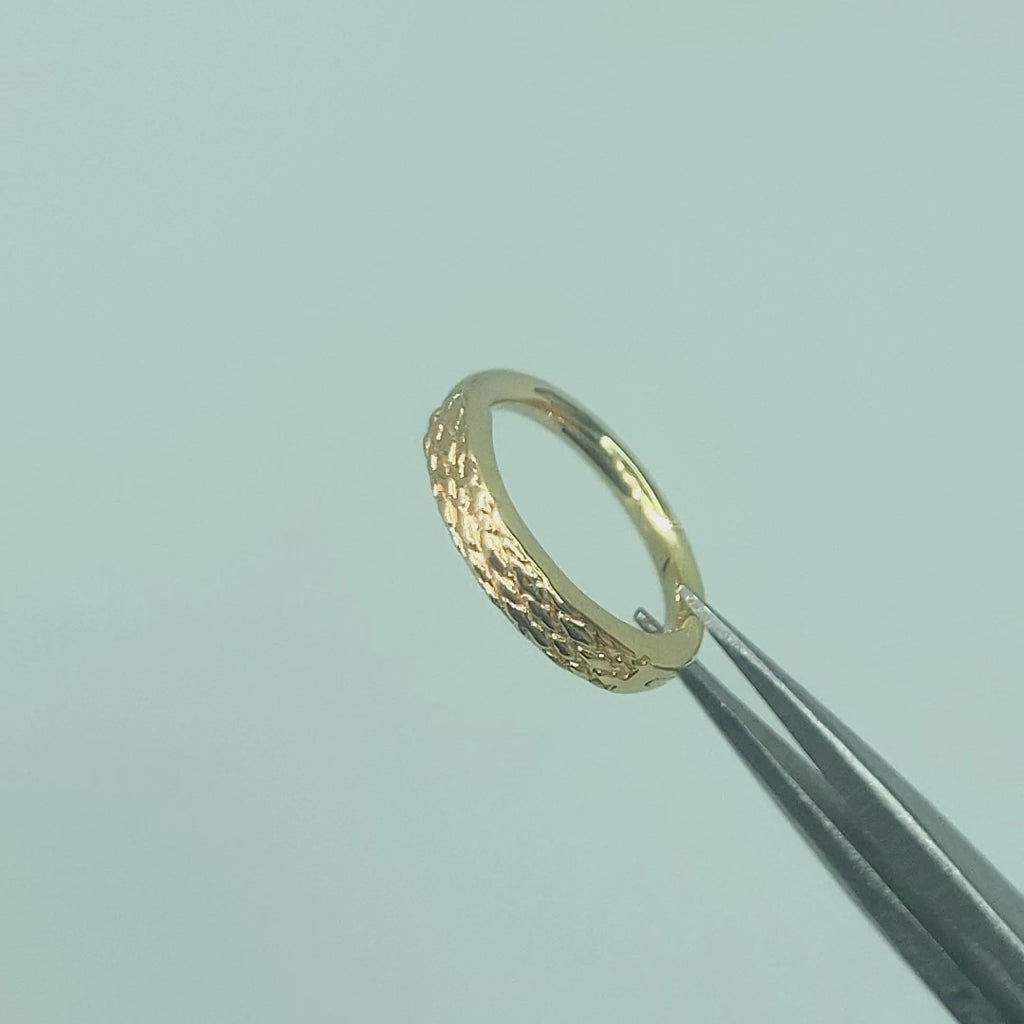  Cinematic clip showcasing the soft, ethereal shimmer of the hand-etched gold surface as it catches the light
