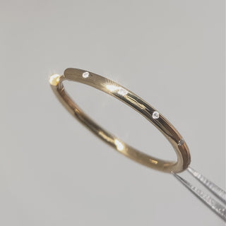 Statement gold diamond hoop earrings worn in motion