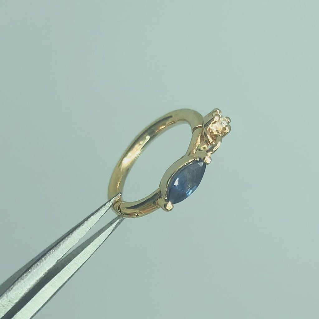  Video demonstrating the deep blue hues and the delicate movement of the diamond charm