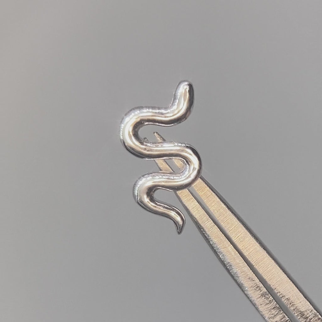 Snake flat back earrings, in 14k white gold, a sleek snake silhouette design and finish.