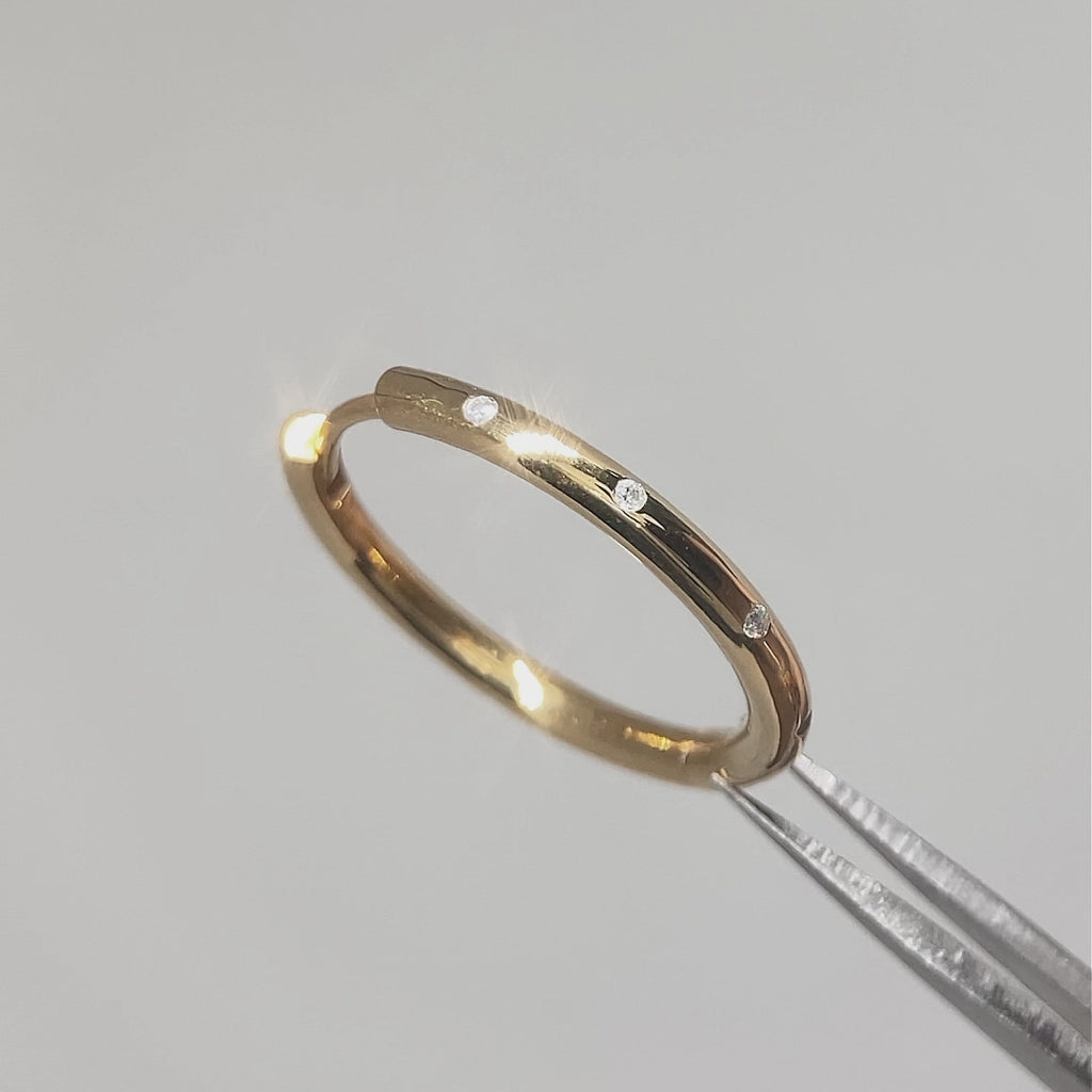 Larger gold hoop earrings with diamonds styled 
