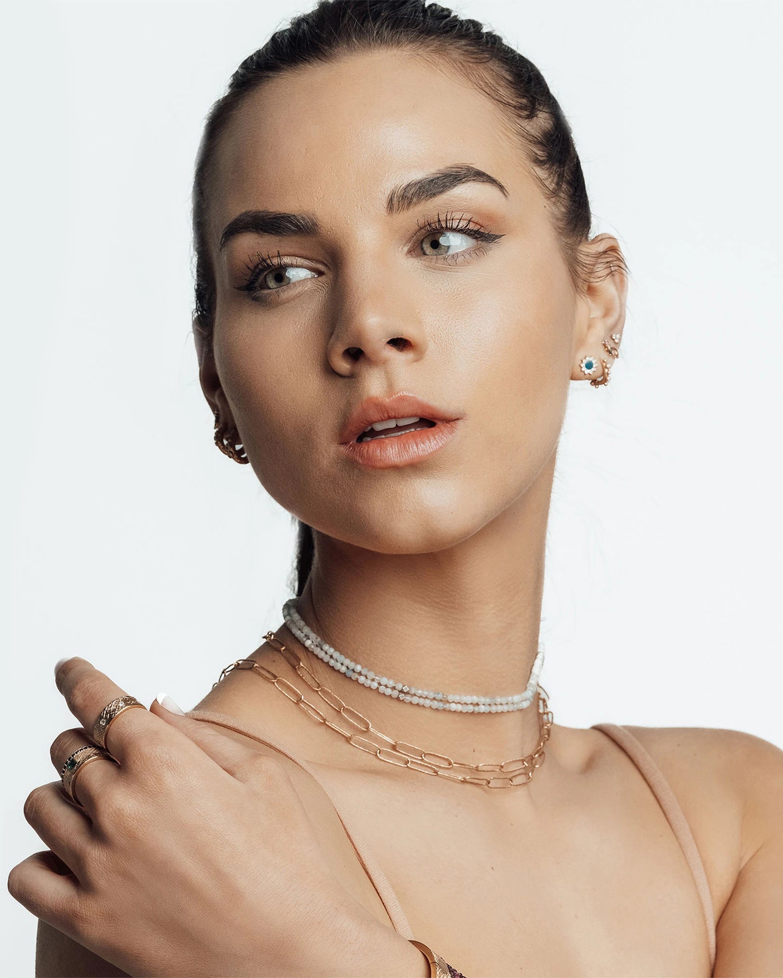 Professional ear piercing consultation at a Nina Wynn studio