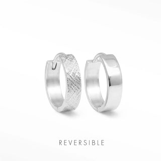 Florentine silver hoop earrings by Wynning feature a reversible design with textured and smooth silver hoop sides