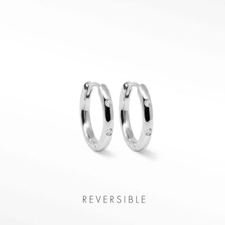 Ellie silver hoop earrings with three small clear earrings diamond gemstones set along each curve by Wynning Reversible Hoops