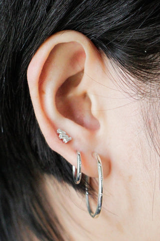 Ellie silver hoop earrings by wynning feature a textured beaded design in silver hoop earrings diamond style