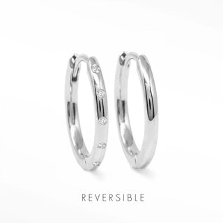 Bold silver hoop earrings with diamond detail