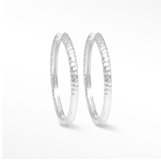 Silver hammered hoop earrings with textured tactile surface made of sterling silver hammered material