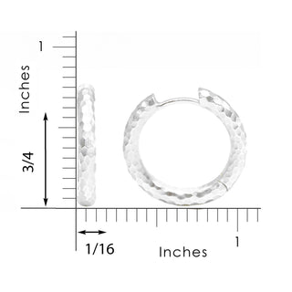 Silver hammered hoop earrings with a textured faceted surface in sterling silver for elegant wear