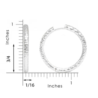Silver hammered hoop earrings with a textured dimpled surface made of sterling silver hammered metal