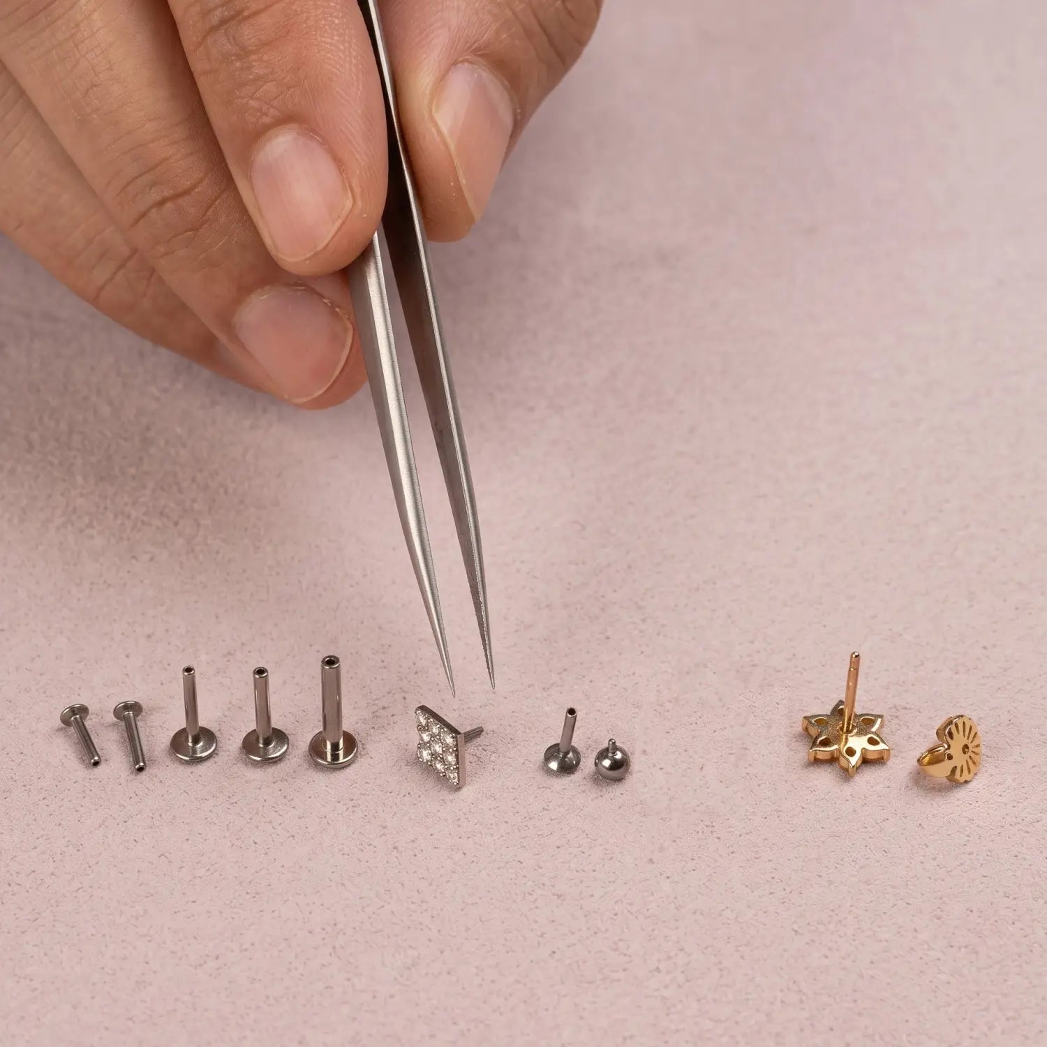 Threadless flat-back earring system showing the decorative top and labret post
