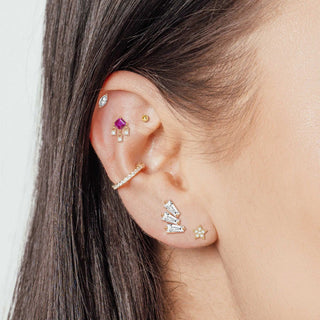 Gold-toned threadless flat ear cuff with clear crystals along its length from the wynning studs collection