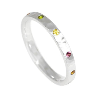 Tourmaline cigar band ring hammer silver featuring a delicate hammered silver band with five colorful round gemstones