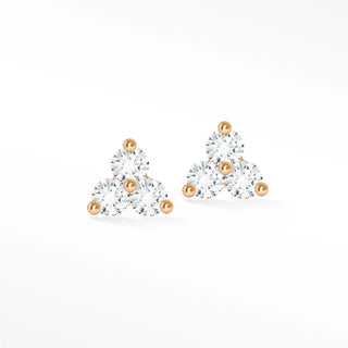 Delicate trinity diamond stud earrings with clear cubic zirconia in 14k rose gold featuring spherical accents