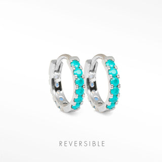 Nina Wynn Natalie 14mm sterling silver reversible hoops with the Genuine Turquoise face forward.