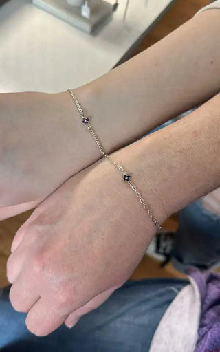 Classic infinity forever bracelet permanently welded onto a wrist in Denver.