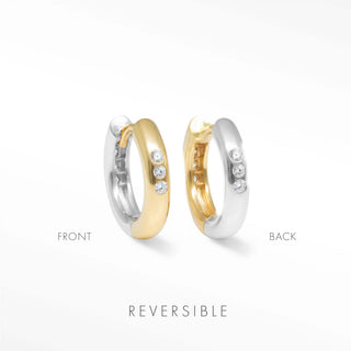 Two tone hoop earrings by Wynning featuring reversible gold and silver finishes with three diamonds on outer edge